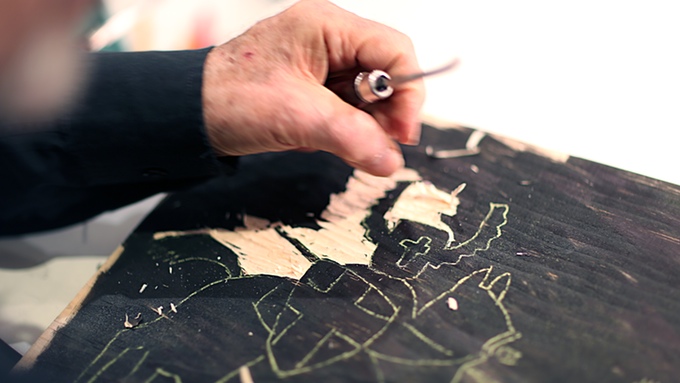 Seymour-Chwast-working-on-a-woodcut-illustration